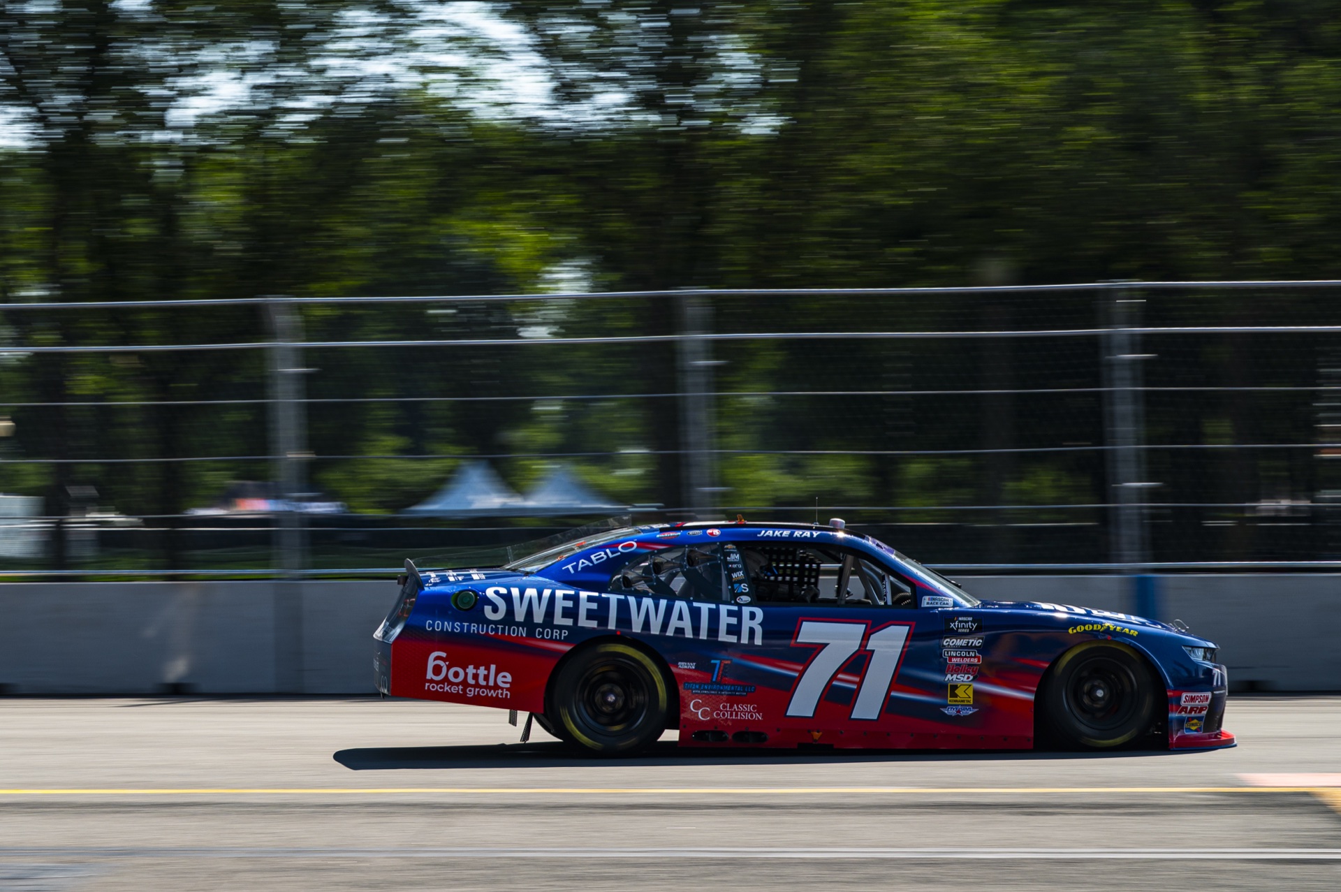 Ryan Ellis Racing number 71 car carrying the Bottle Rocket Growth logo at speed on the Chicago street circuit