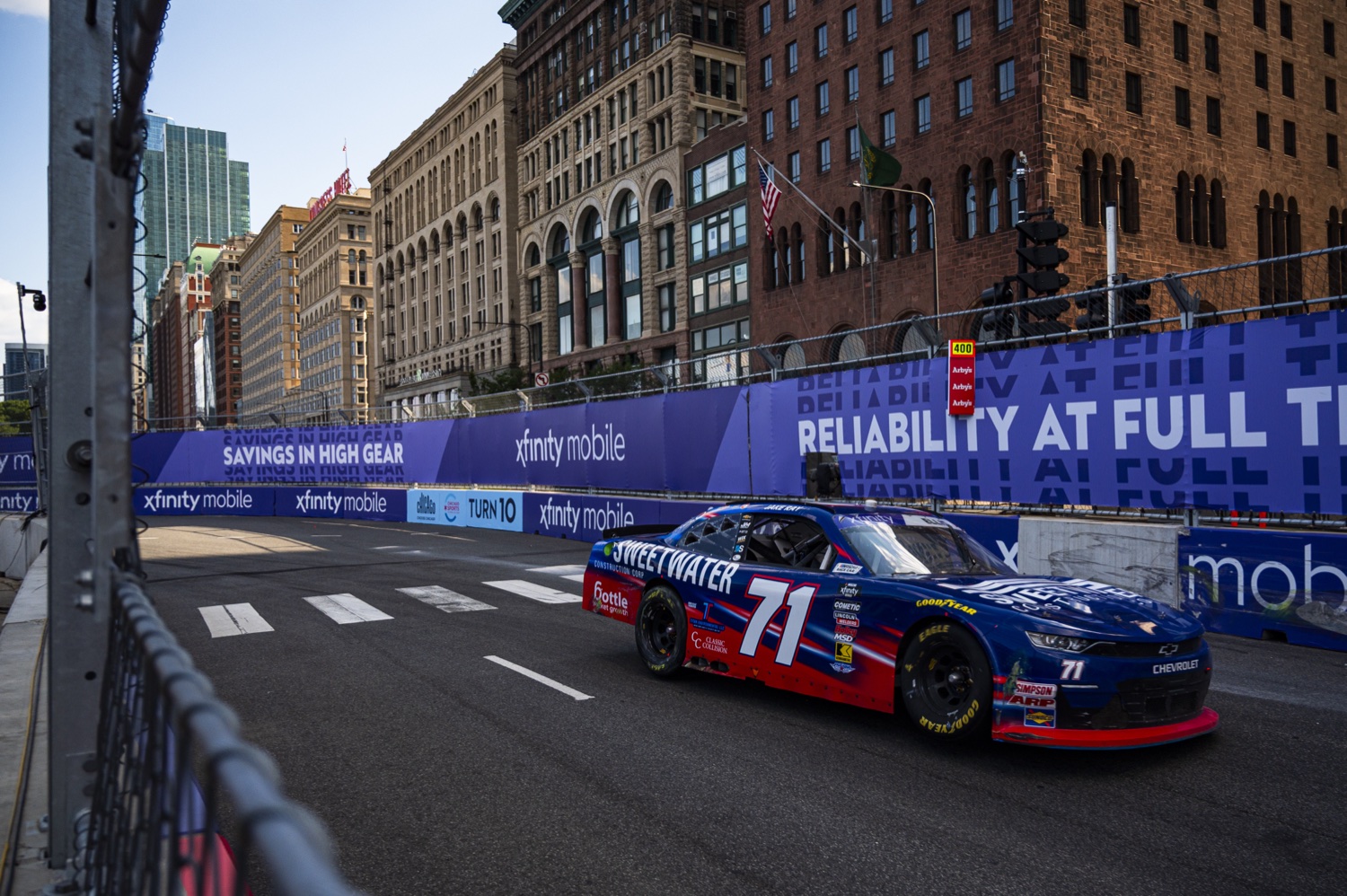 Ryan Ellis Racing number 71 car on a Chicago street circuit with the Bottle Rocket Growth logo visible on the rear quarter panel